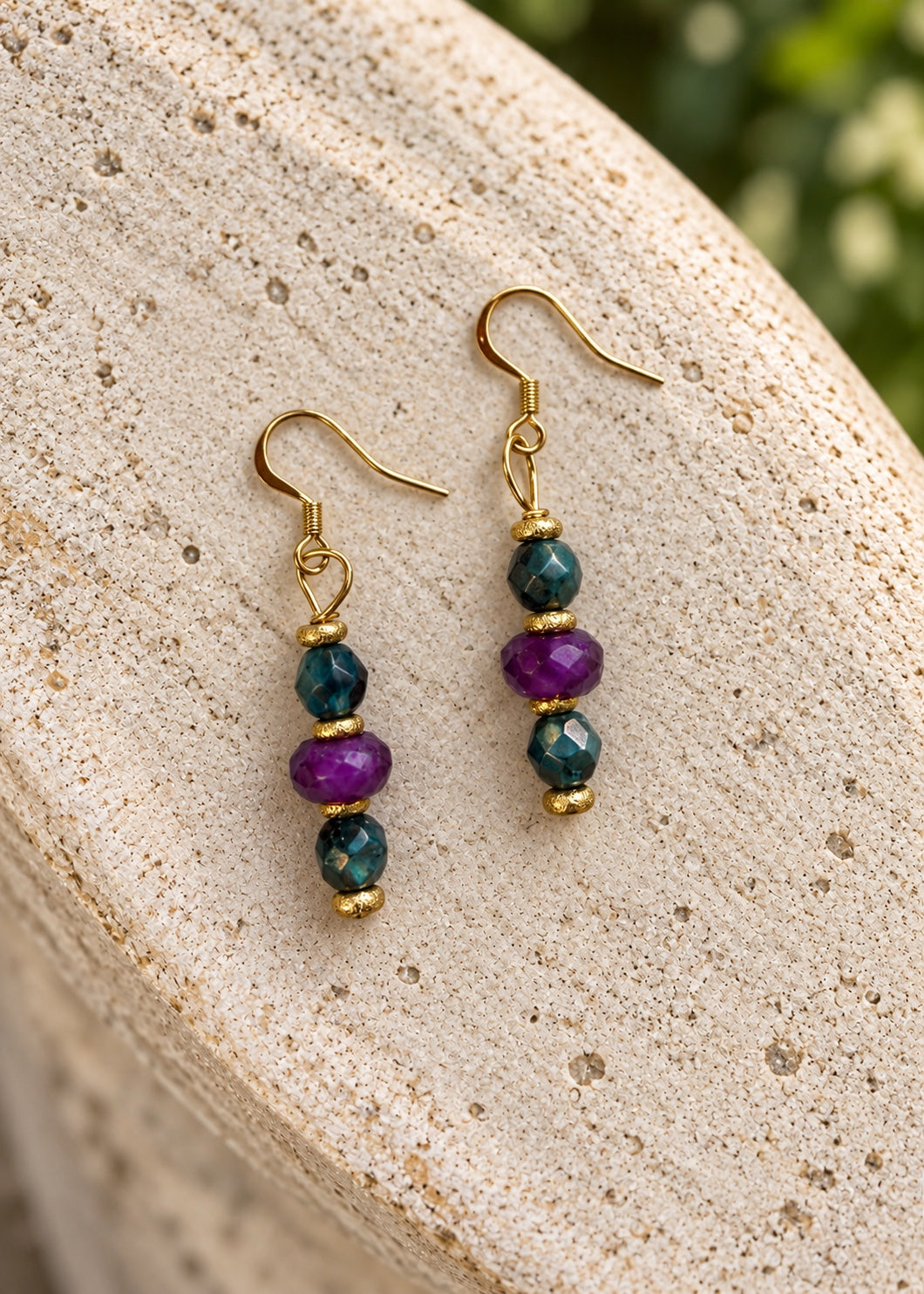Complimentary Gilded Garden earrings on light stone
