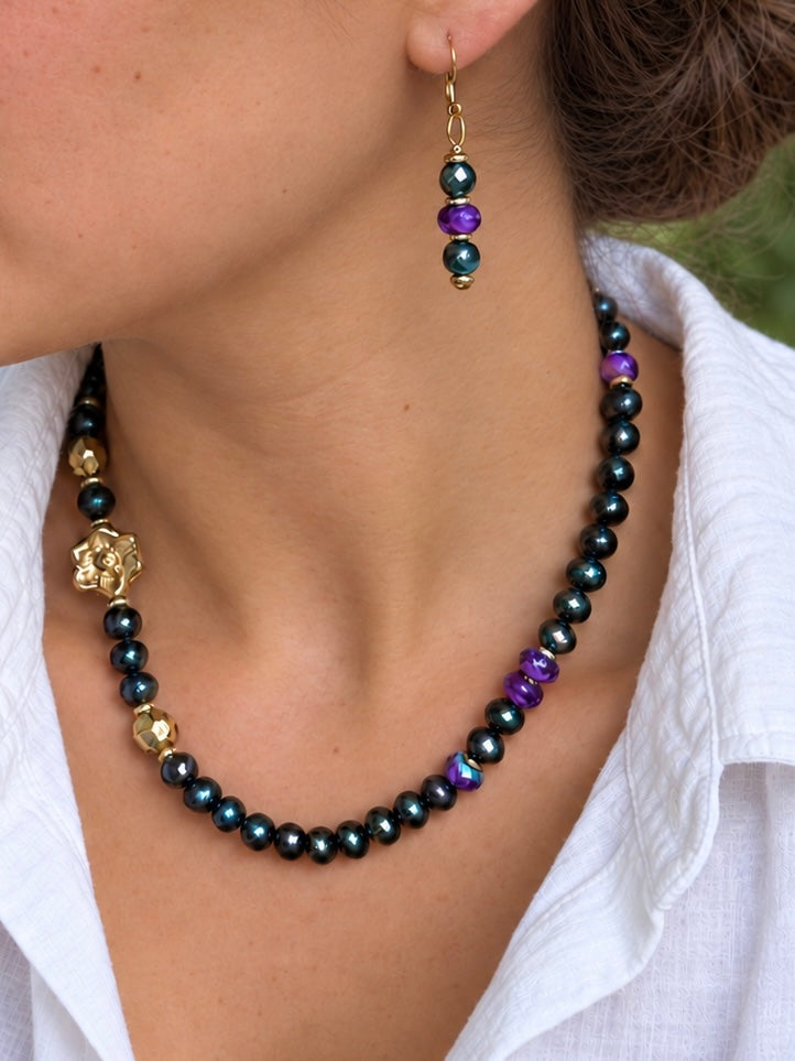 Where Magnolias Grow necklace and coordinating gold earrings worn by a model