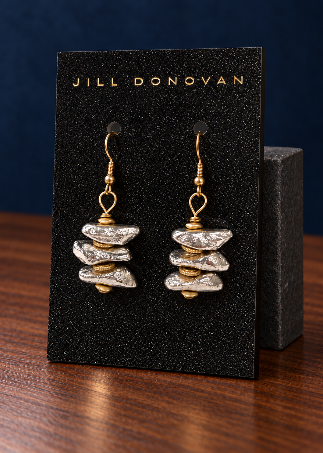 Silver Stacked Earrings displayed on a lucite card