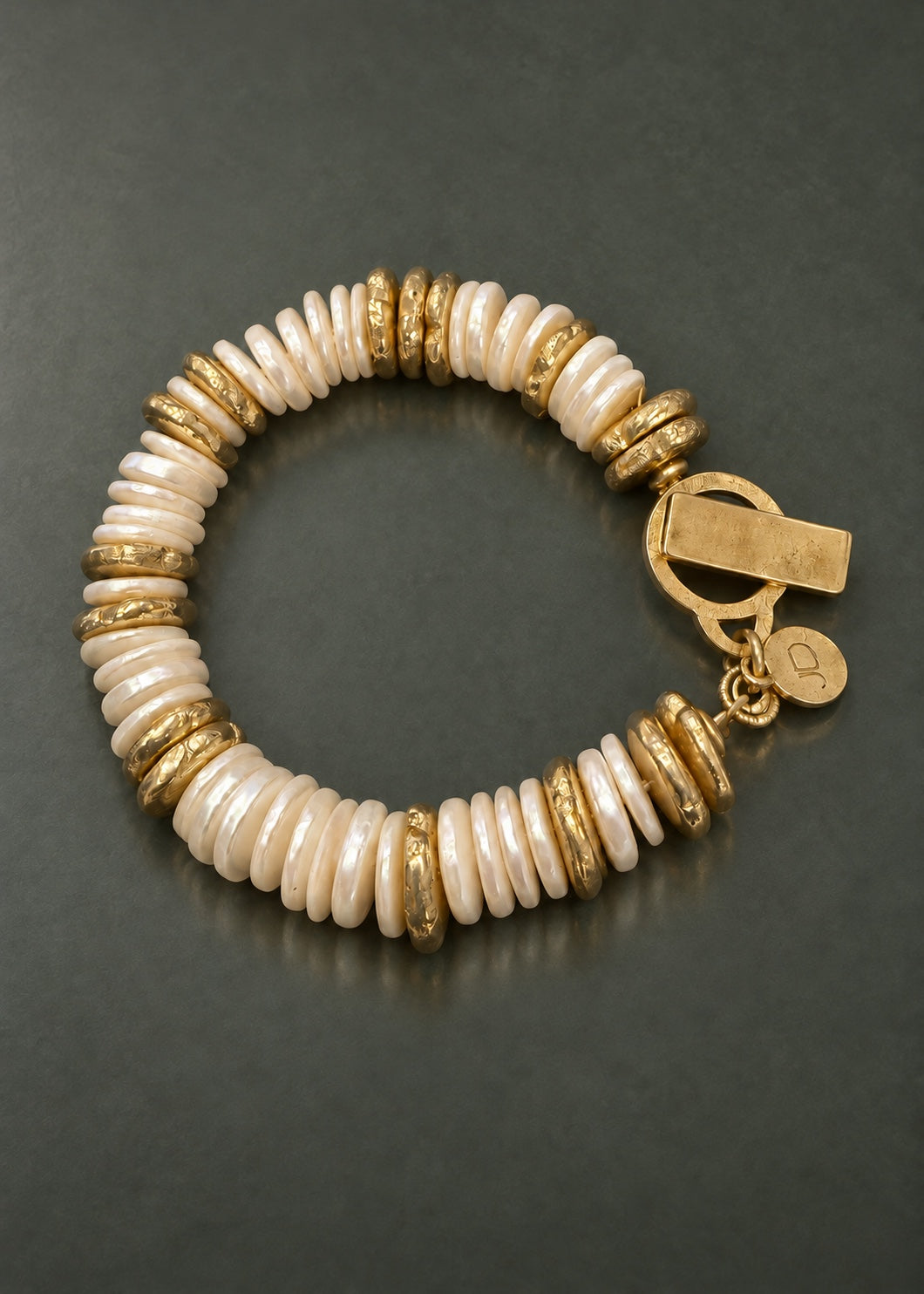 In Good Company shell pearl and cast brass disc bracelet, overhead view