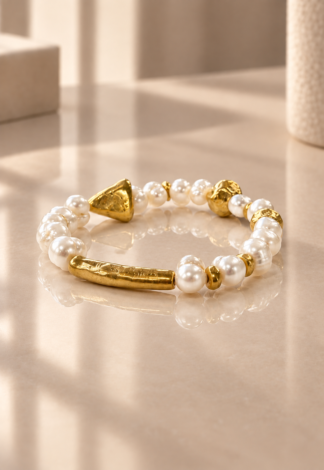 Poetic Pearl - Unscripted on reflective ivory surface