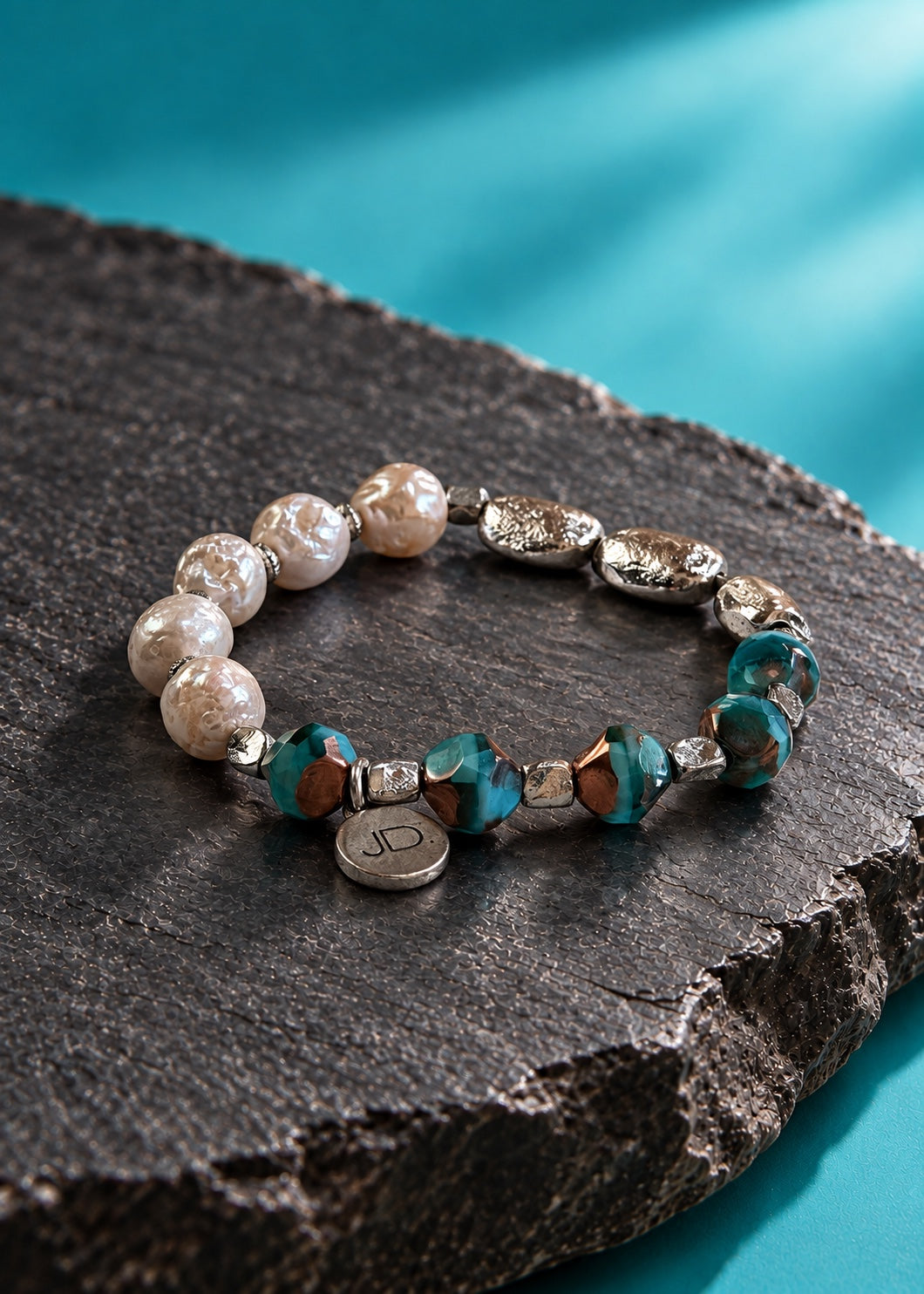 Silver Stepping Stones bracelet on dark stone