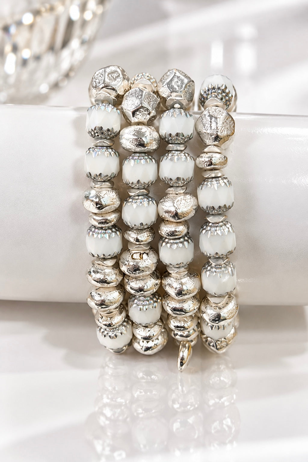 Several Cathedral White bracelets displayed together
