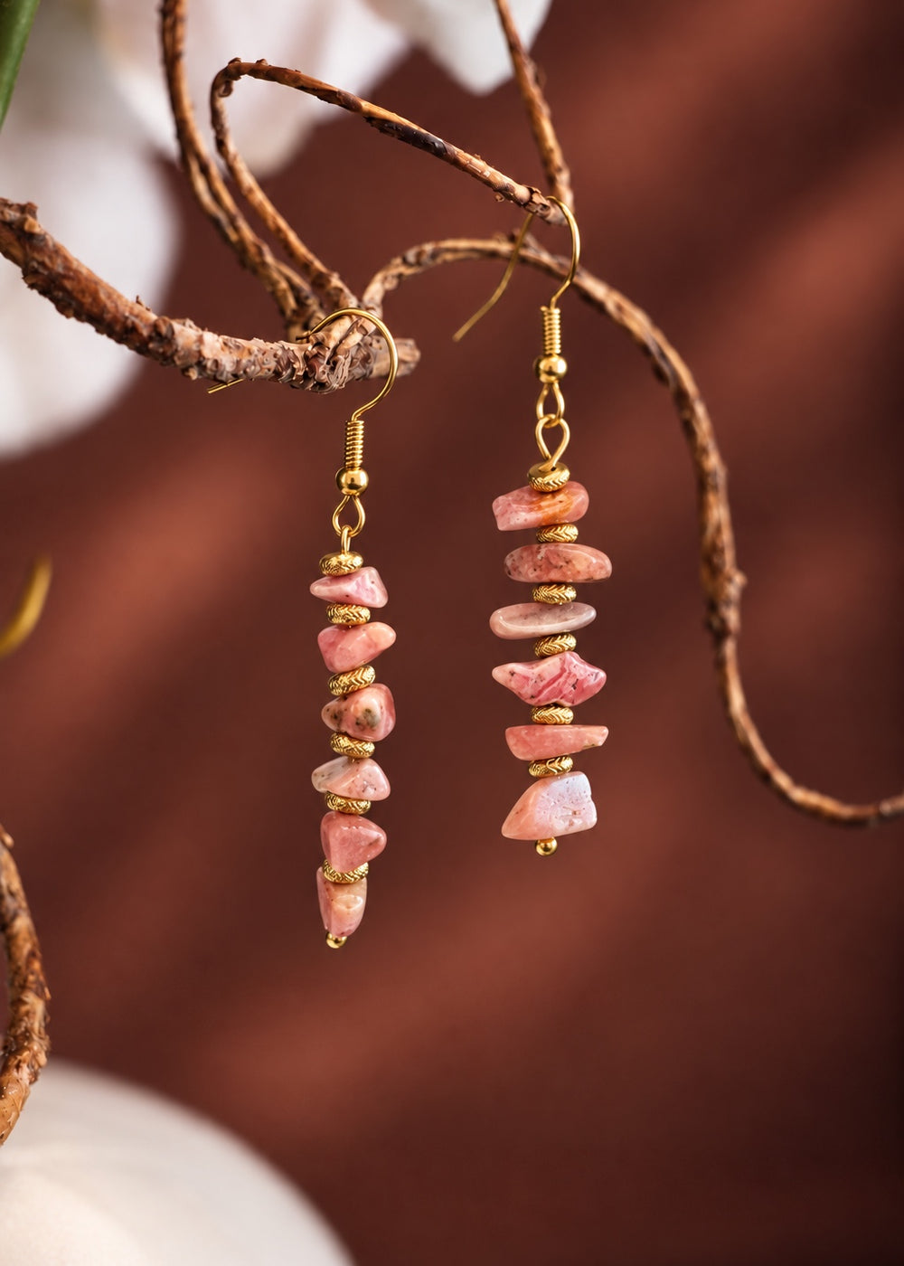 Rhodochrosite Drop Earrings - Gold hanging from a branch
