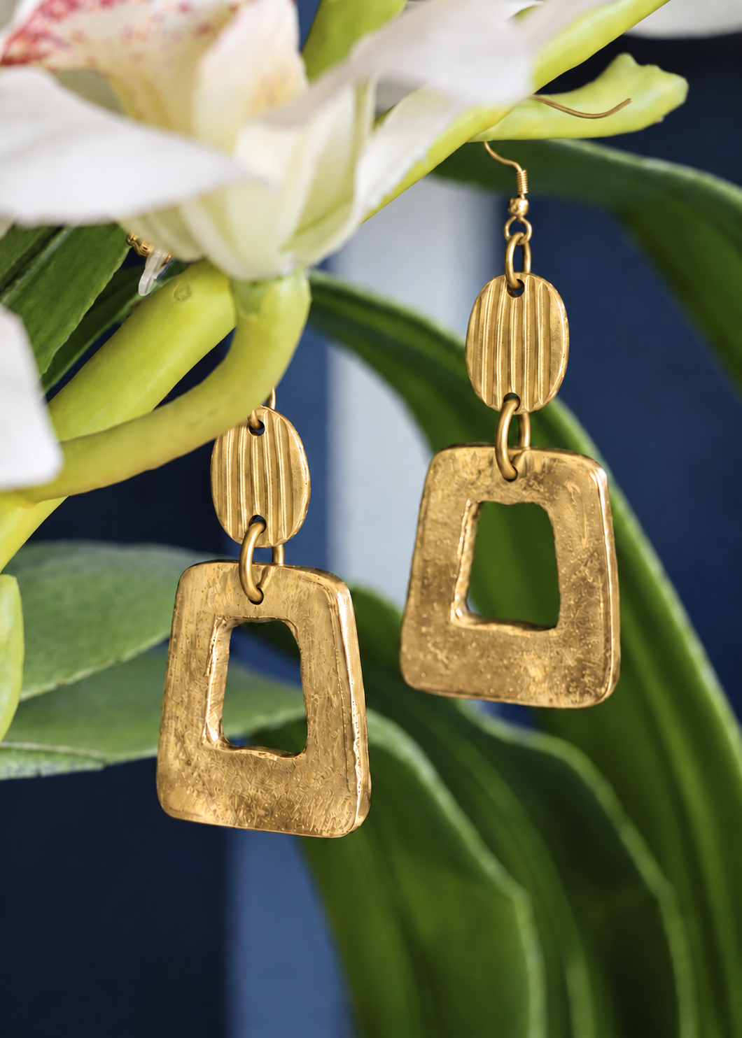 Golden Open Frame Earrings with vertically ridged oval connectors
