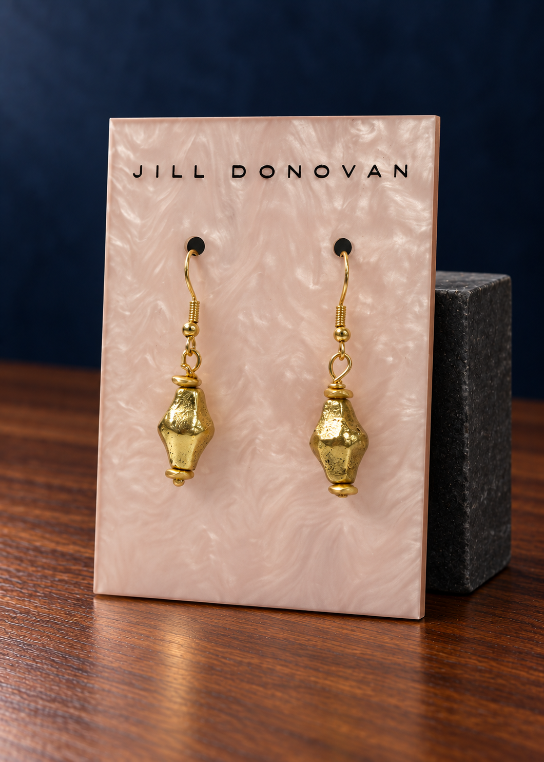Golden Tapered Drop Earrings on a Jill Donovan lucite card