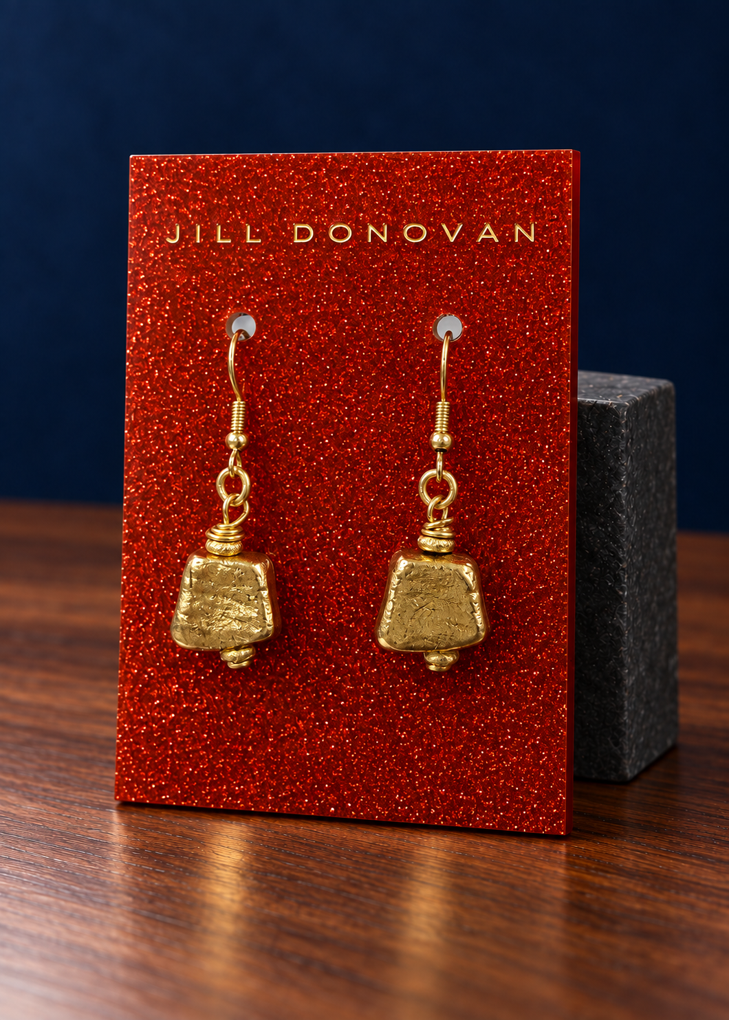 Golden Trapezoid Drop Earrings on a Jill Donovan lucite card