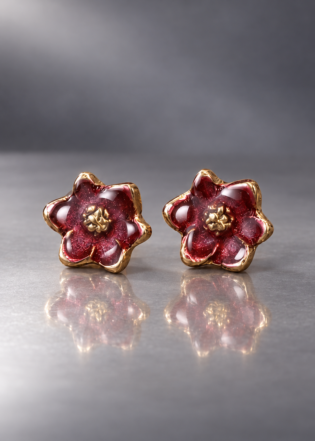 Burgundy brass magnolia stud earrings with domed resin