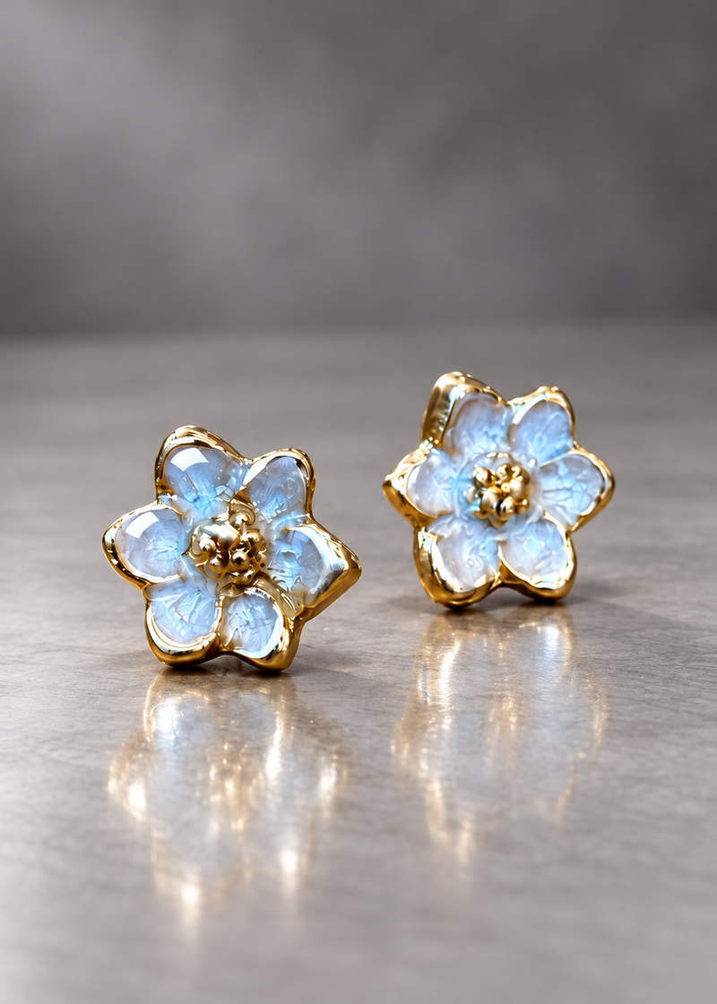 Pale Blue brass magnolia stud earrings with domed resin