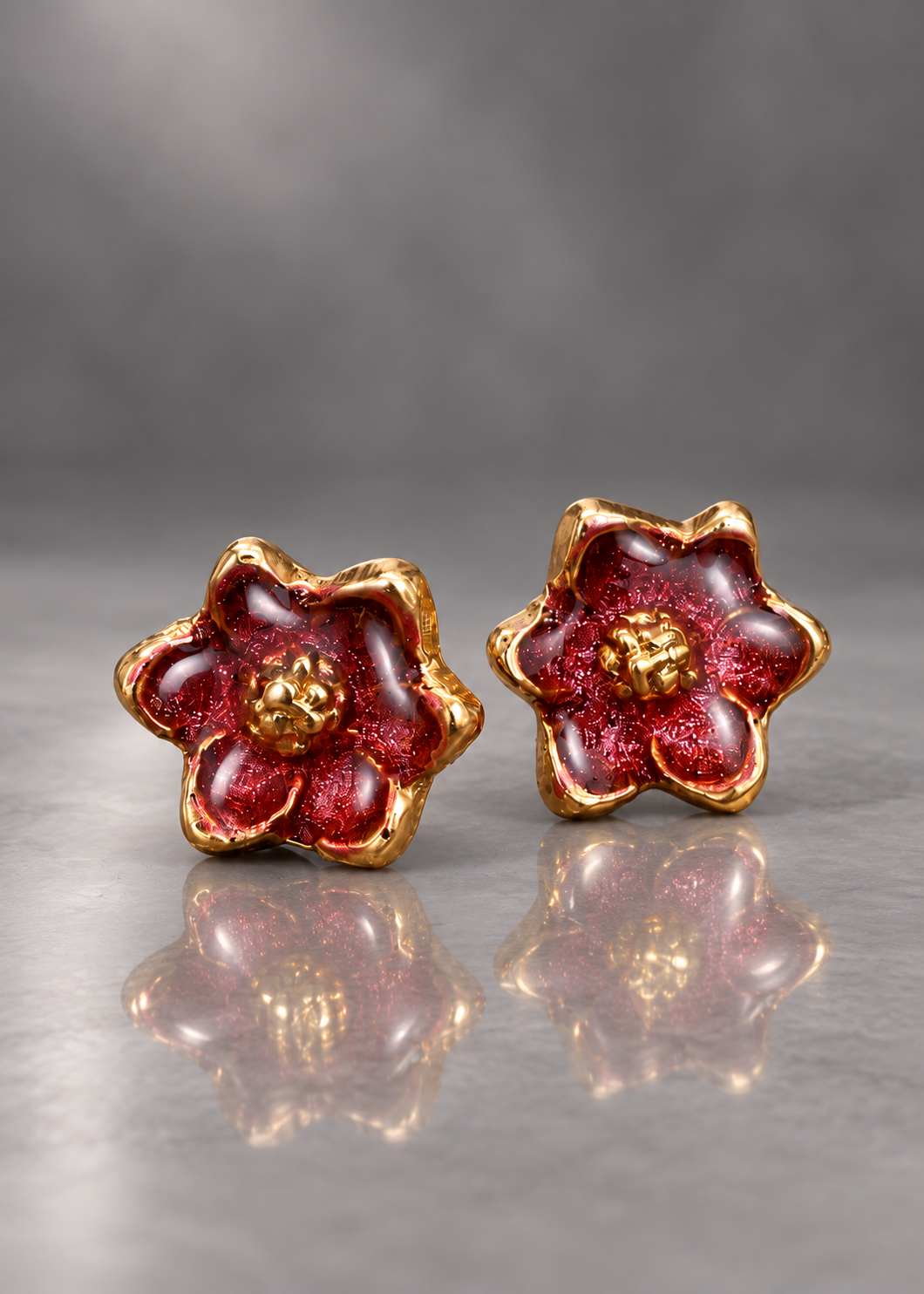 Burgundy brass magnolia stud earrings with domed resin