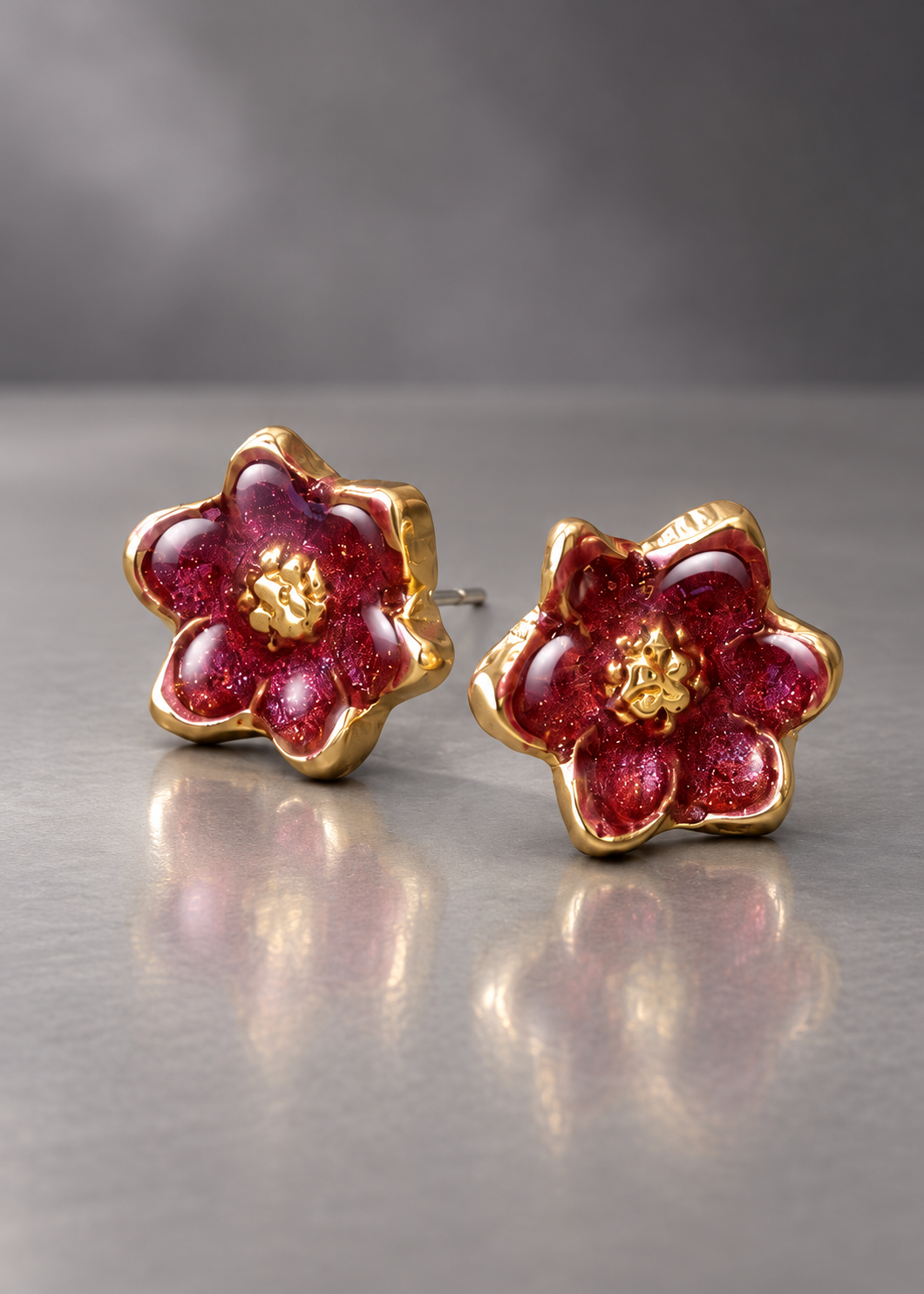 Burgundy brass magnolia stud earrings with domed resin