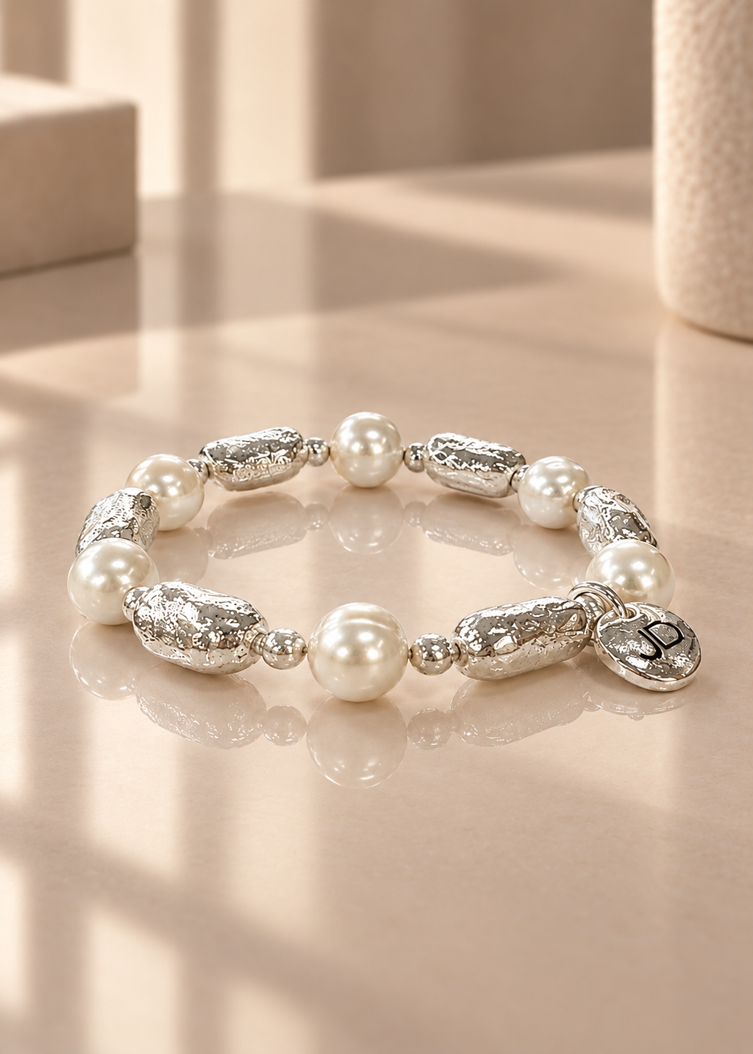 Poetic Pearl - At Last on reflective ivory surface
