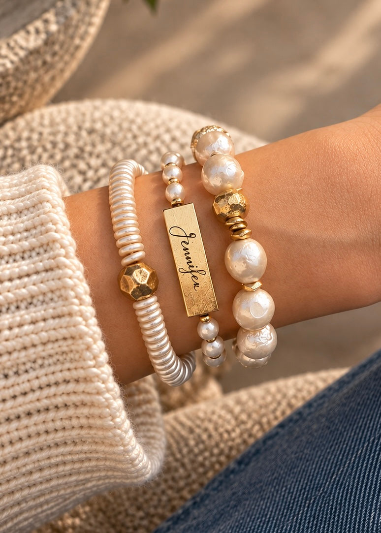 Poetic Pearl bracelets styled together on a wrist, including Golden Center and Yours Truly