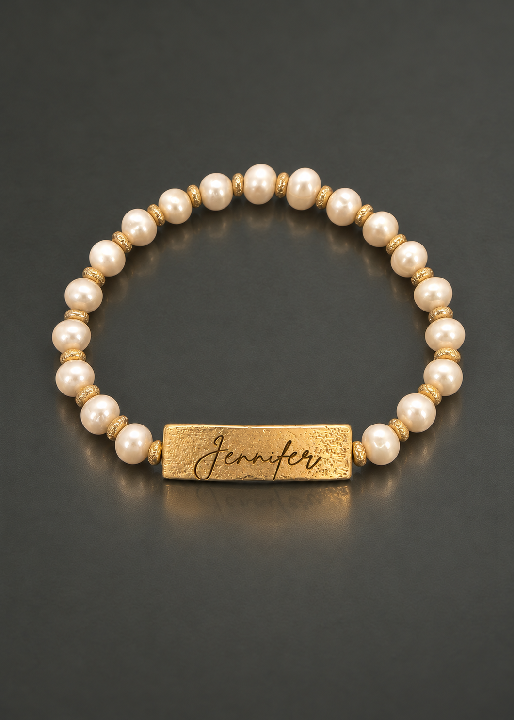 Yours Truly personalized freshwater pearl bracelet, overhead view, Jennifer engraving example