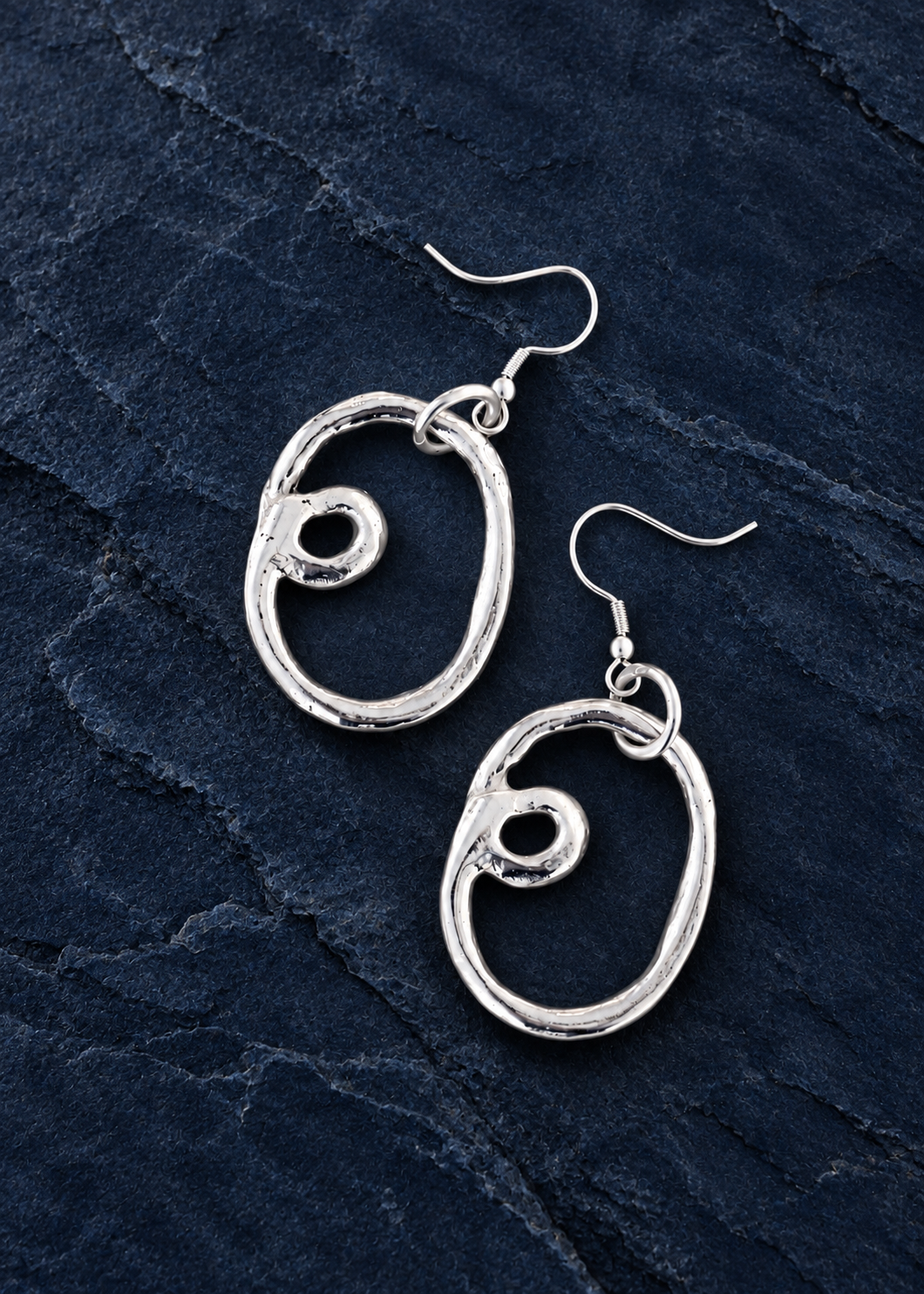 Silver Loop Drop Earrings on deep navy stone