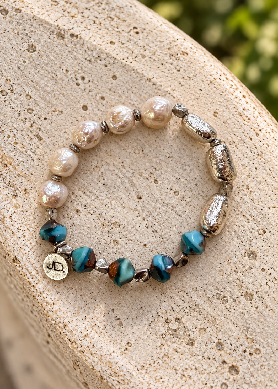 Silver Stepping Stones bracelet on light stone