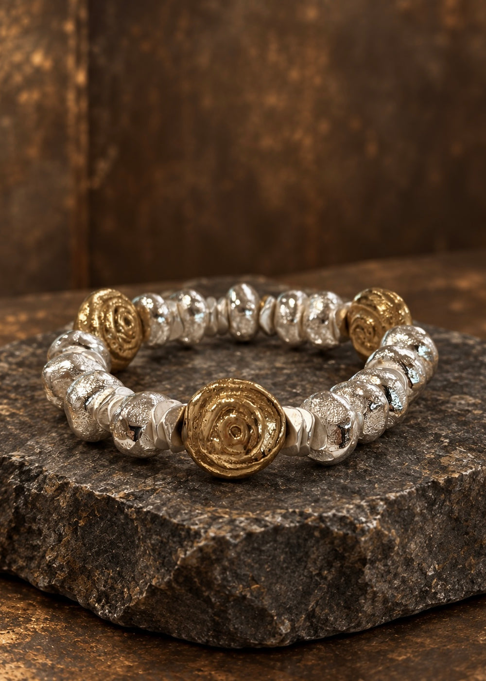 Cast brass bracelet with three spiral medallions and organic silver-plated brass spacers